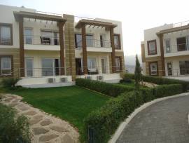 Двухкомнатная квартира с садом в великолепном комплексе в Кирении-Алсанджак